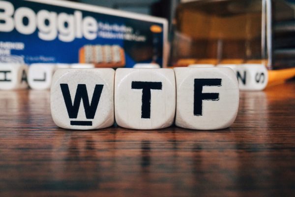 The letters W, T and F on a set of white dice